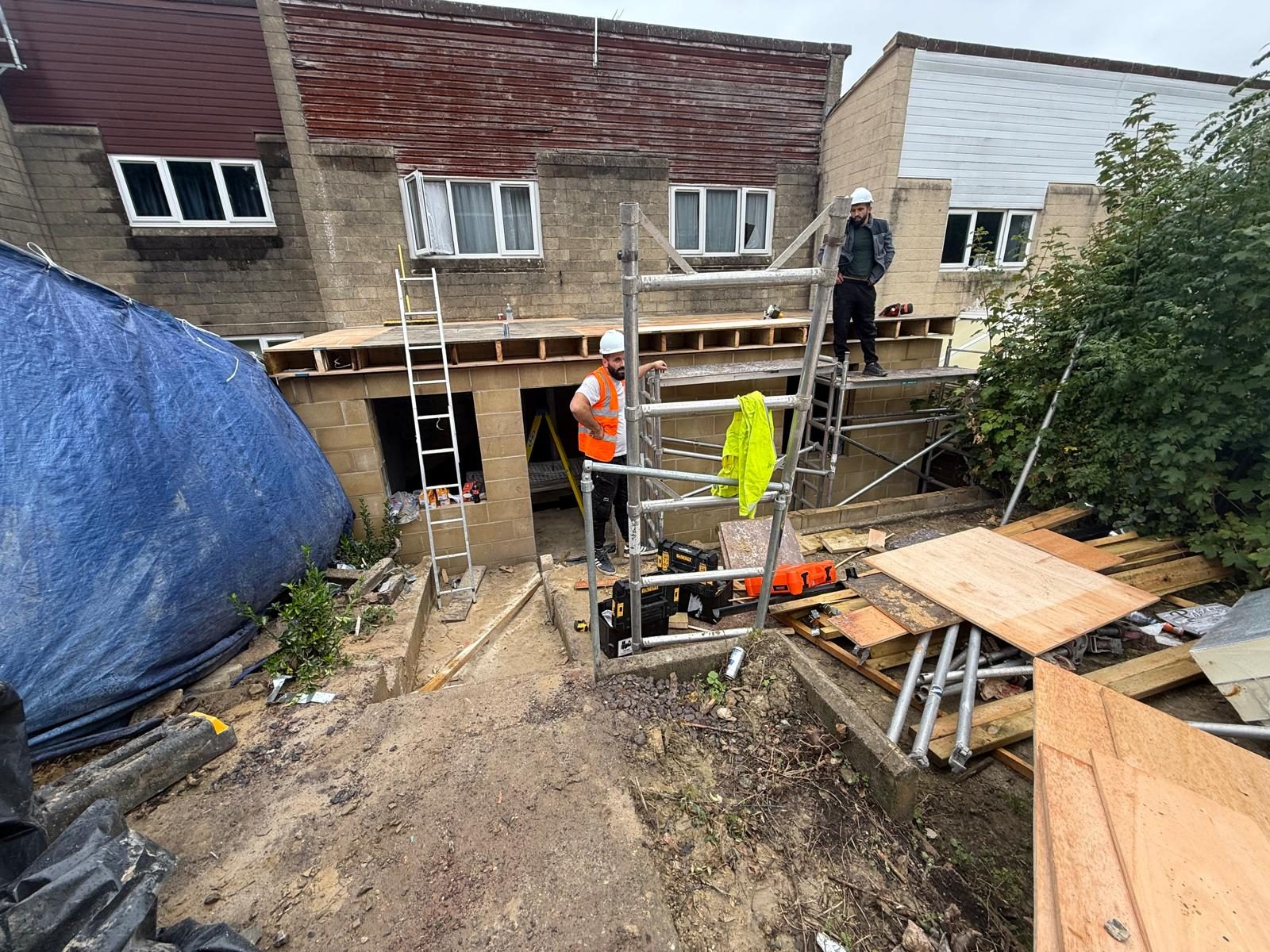 Purple Construction team on scaffolding during a rear extension build in Bath